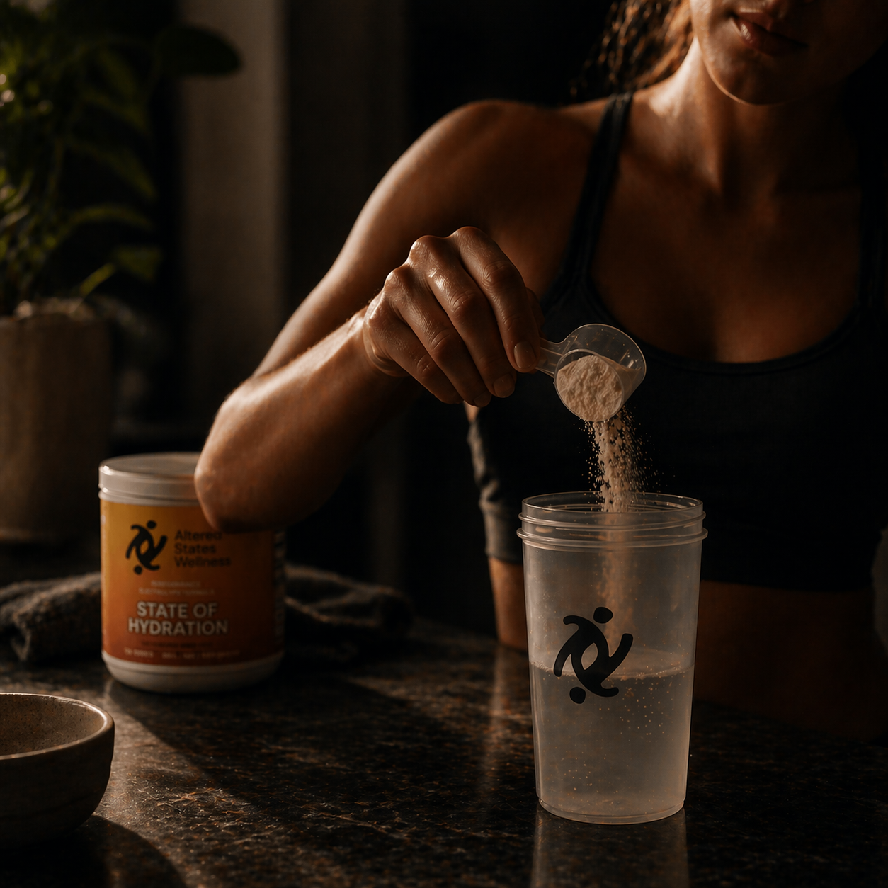 Person pouring powder from a container into a glass of water with a focus on hydration.